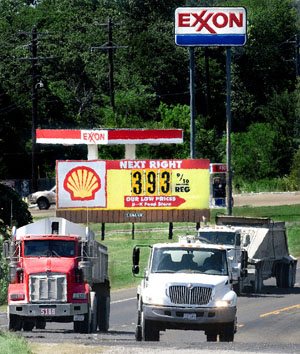 Photo of trucks and sign of gas prices