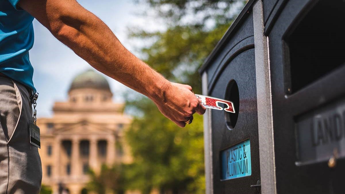 man puts permit into trash